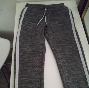 Grey sweatpants with two white lines in the side